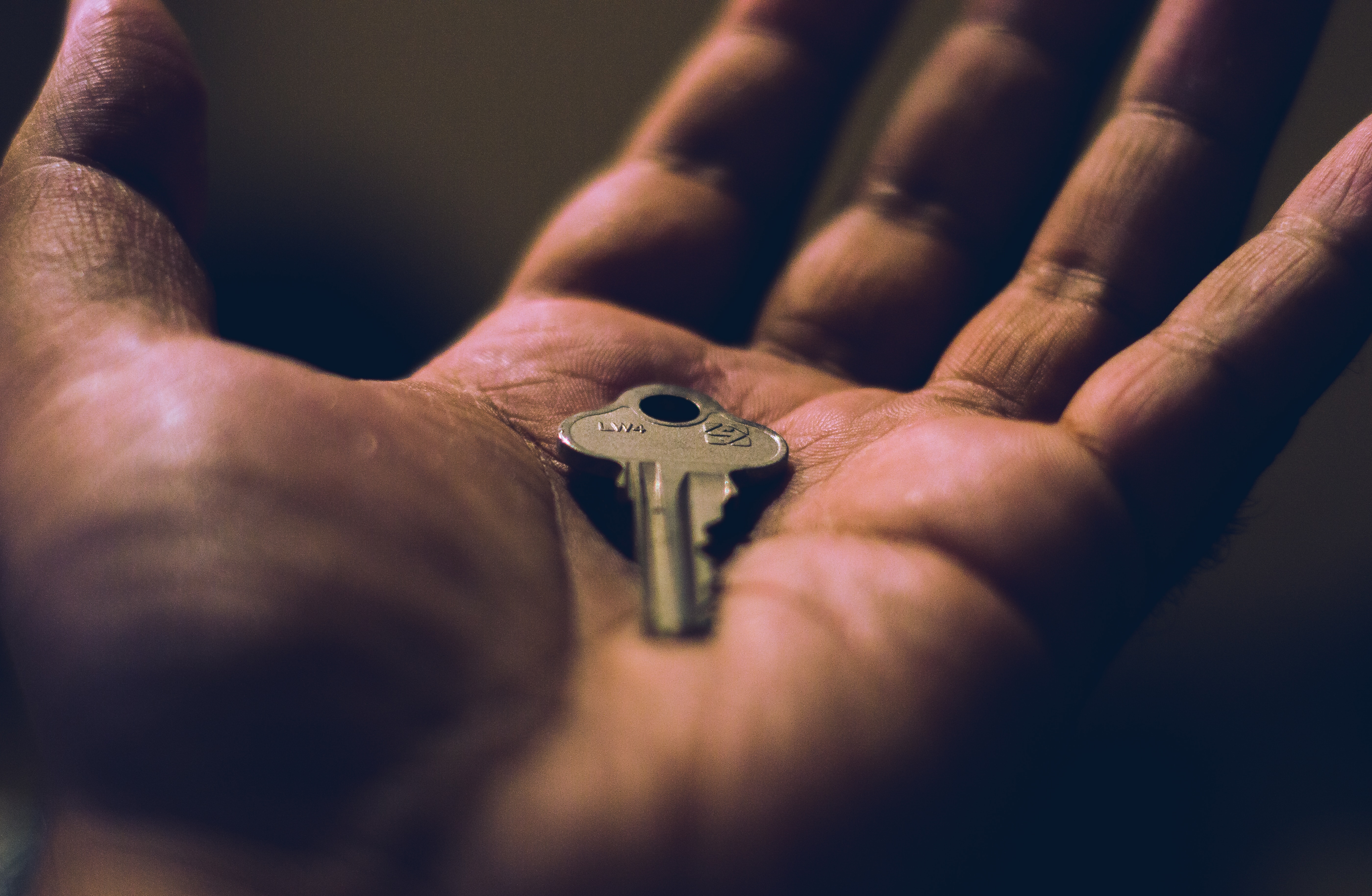 A key in a human hand